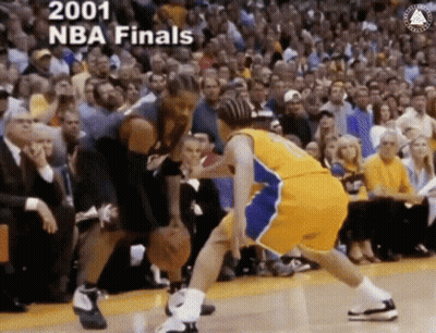 Two Basketball Players Are Playing A Game In Front Of A Crowd And The Words 2001 Nba Finals Are On The Bottom GIF