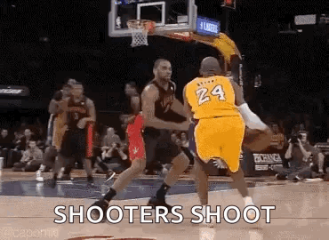 two basketball players are playing a game of basketball on a court and one of them is wearing a number 24 jersey .