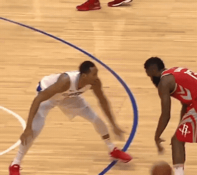 Two Basketball Players Are Playing A Game Of Basketball On A Court . One Of The Players Has The Number 24 On His Shorts GIF