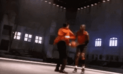 Two Basketball Players Are Playing A Game Of Basketball On A Court GIF