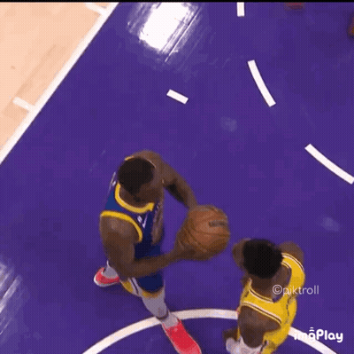 Two Basketball Players Are Playing A Game Of Basketball On A Purple Court GIF