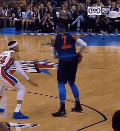 Two Basketball Players Are Playing A Game On A Court . One Of The Players Has The Number 7 On His Jersey . GIF