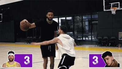 Two Basketball Players Are Playing On A Court With The Number 3 On The Side GIF