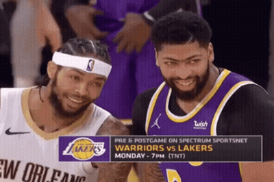 Two Basketball Players Are Smiling In Front Of A Sign That Says Warriors Vs. Lakers GIF