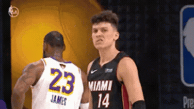 Two Basketball Players Are Standing Next To Each Other And One Of Them Has The Number 23 On His Jersey GIF