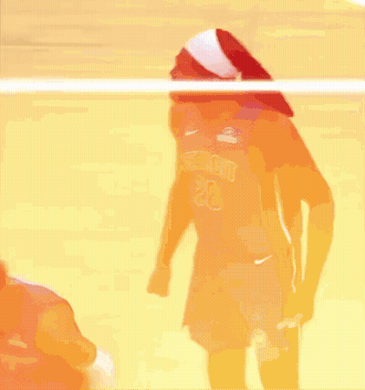 Two Basketball Players Are Standing Next To Each Other On A Court . One Of The Players Is Wearing A Detroit Jersey . GIF