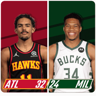 Two Basketball Players From The Hawks And The Bucks Are Standing Next To Each Other GIF