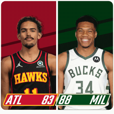 Two Basketball Players From The Hawks And The Bucks Are Standing Next To Each Other GIF