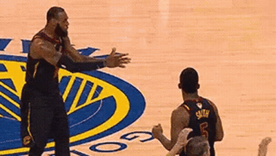 Two Basketball Players Hugging On Court GIF