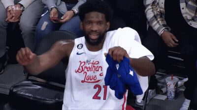 Two Basketball Players In Blue 76Ers Shirts GIF