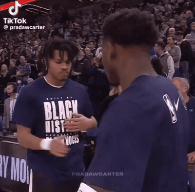 Two Basketball Players In Front Of Crowd GIF