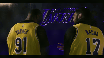 Two Basketball Players In Yellow Jerseys Number 91 And 17 GIF