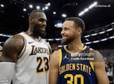 Two Basketball Players , Lebron James And Stephen Curry , Are Standing Next To Each Other And Smiling . GIF