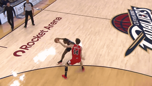 Two Basketball Players On A Court With Rocket Arena On The Floor GIF
