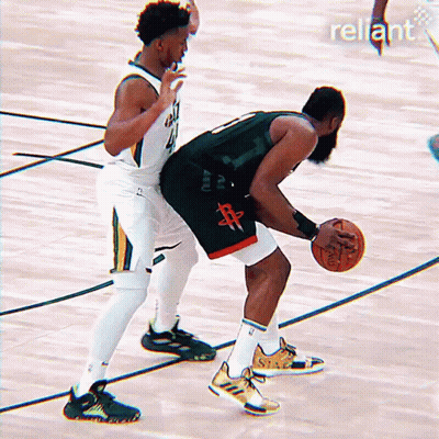 Two Basketball Players On A Court With The Word Reliant On The Bottom Right GIF