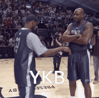 Two Basketball Players On A Court With Ykb Written On The Floor GIF