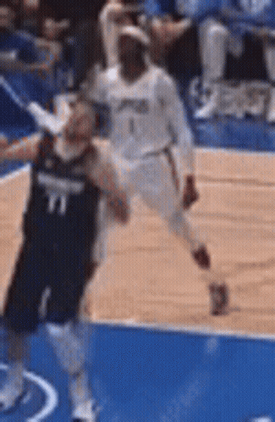 Two Basketball Players On Blue Court GIF