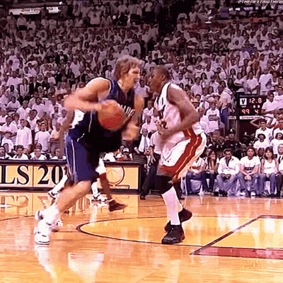 Two Basketball Players On Court Scoreboard Ls20 GIF