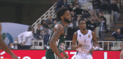 Two Basketball Players On Court With Crowd GIF