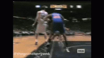 Two Basketball Players One In Blue Jersey GIF