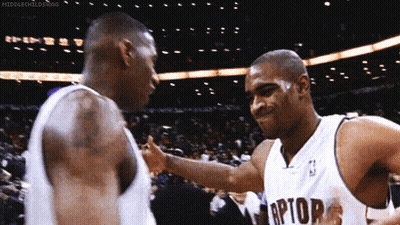 Two Basketball Players One In Raptors Jersey GIF