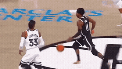 Two Basketball Players Playing Game One Wearing Number 33 Jersey GIF
