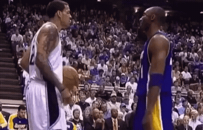 Two Basketball Players Standing Before Crowd GIF