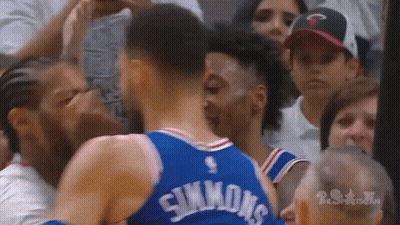 Two Basketball Players Standing In Front Of Crowd GIF