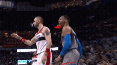 Two Basketball Players Standing In Stadium With Bud City Sign GIF