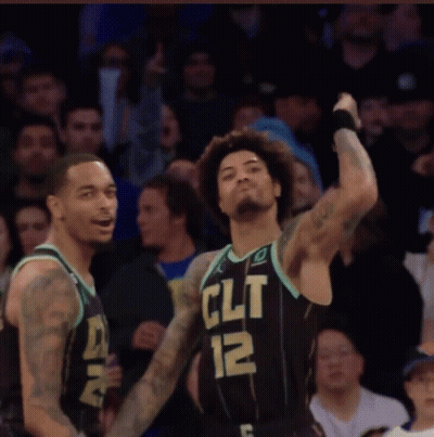 Two Basketball Players Wearing Black Jerseys That Say Clt GIF