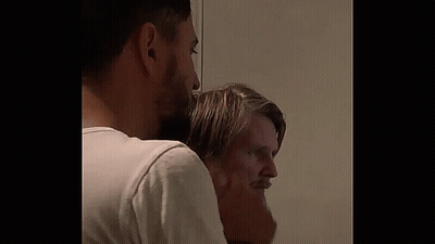 Two Bearded Men Standing In Room GIF