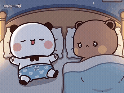 Two Bears Laying in Bed With Chinese Writing