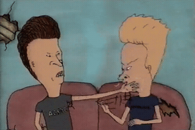 Two Beavis And Butthead Characters Are Sitting On A Couch And One Is Pointing At The Other GIF