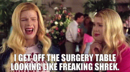 Two Blonde Women Are Laughing And Talking To Each Other While Sitting At A Surgery Table . GIF