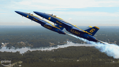Two Blue Jets From The U.s. Navy Are Flying In Formation GIF