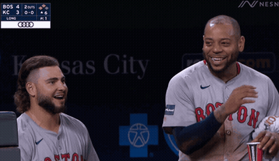 Two Boston Red Sox Players Are Laughing During A Game GIF