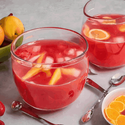 Two Bowls Of Punch With Spoons And Fruit Bowl GIF