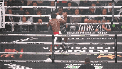Two Boxers Are Fighting In A Boxing Ring With Mgm Rewards Written On The Ropes GIF