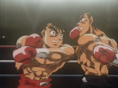 Two Boxers Are Fighting In A Ring And One Is Wearing Pink Gloves GIF