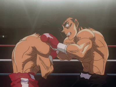 Two Boxers Are Fighting In A Ring And One Is Wearing Red Boxing Gloves GIF