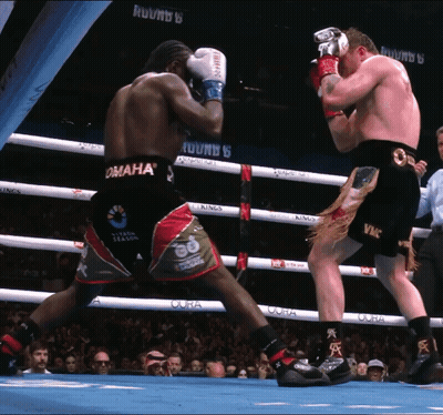 Two Boxers Are Fighting In A Ring That Says Omaha On It GIF