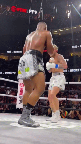 Two Boxers Are Fighting In A Ring With A Sign That Says Showtime Ppv GIF