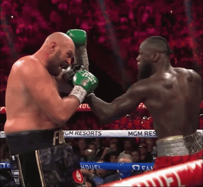 Two Boxers Are Fighting In A Ring With Mgm Resorts Written On The Ropes GIF