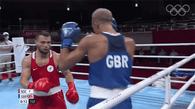 Two Boxers Fighting In Ring One Wearing GBR Shirt GIF