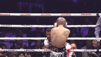 Two Boxers Fighting In Ring With Docomo Ropes GIF