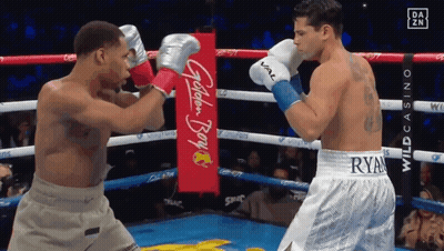 Two Boxers Fighting In Ring With Golden Boy Banner GIF