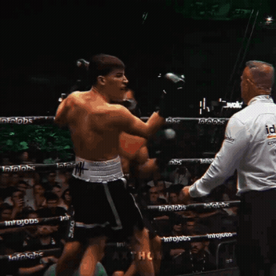 Two Boxers Fighting In Ring With Infojobs On Ropes GIF