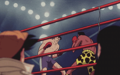 Two Boxers Fighting in Ring With Number 11 on Shorts