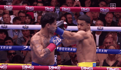 Two Boxers Fighting In Ring With Ring On Ropes GIF