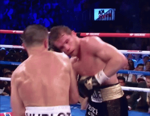 Two Boxers In A Boxing Ring With One Wearing A Belt That Says Tecate On It GIF